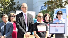 Members of the coalition San Diegans for Healthcare Coverage listen to a speaker railing against Republican attempts to replace Obamacare, July 26, 2017.