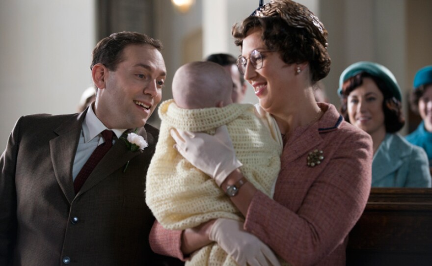 Ben Caplan as PC Noakes and Miranda Hart as Chummy in church with baby Freddie.