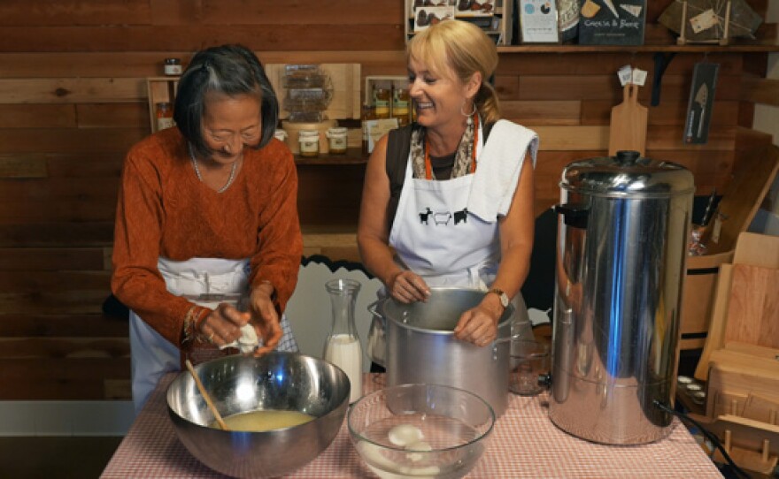 Host Su-Mei Yu makes cheese with Gina Freize, owner of Venissimo Cheese.