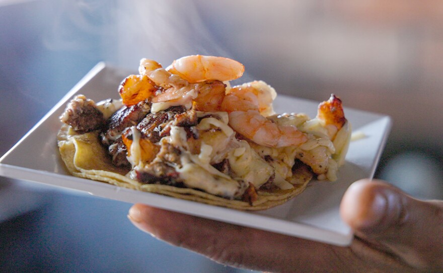 A shimp taco is prepared at Taco Loco in Rosarito. Mexico