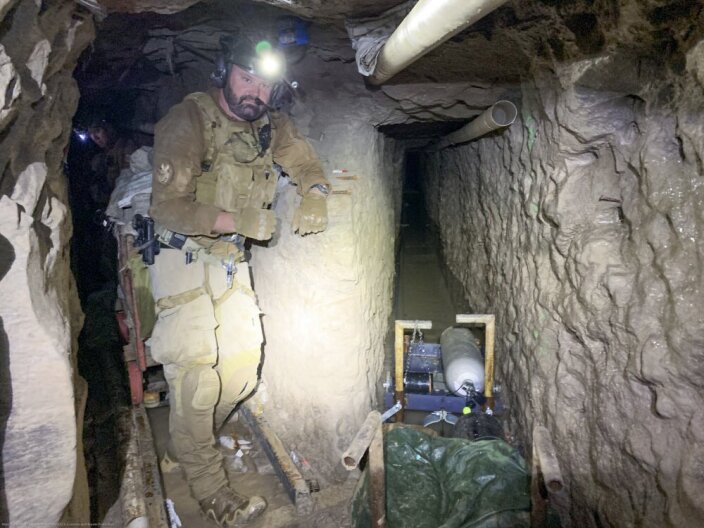 A tunnel entry team agent stands by for security Nov. 13, 2019, at a tunnel spur that went off in a different direction. Customs and Border Protection announced the find Jan. 29, 2020.