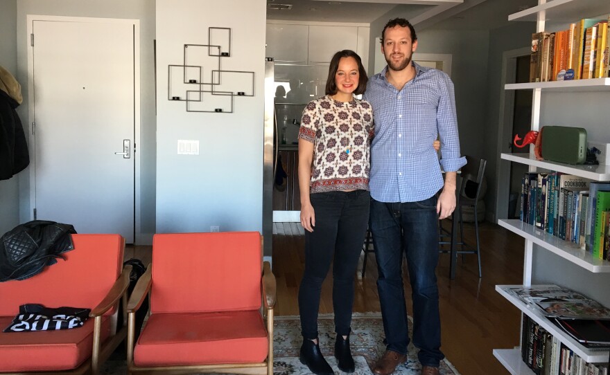 Robin Bunevich and Alex Rivas in the Astoria, Queens, apartment they own. The unmarried couple set an agreement for how to handle the sale of their apartment if they break up.