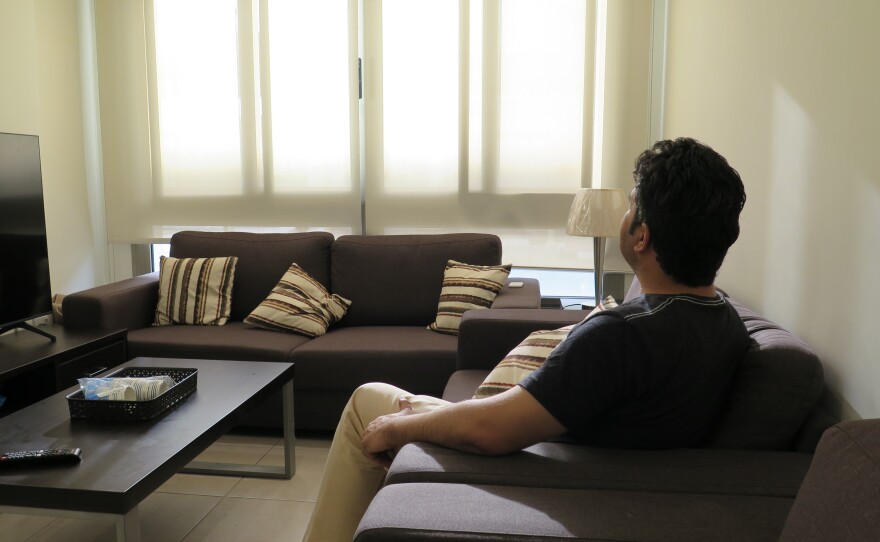 Wali, the Afghanistan National Institute of Music's program manager, sits in a classroom at the Park View Villas compound in Doha. "Sometimes we feel happy, we are safe," he says. "But at the same time, leaving your world behind, your homeland, whatever you have, is extremely tough, extremely tough. But we will never lose hope one day we could return back to Afghanistan." <strong> </strong>