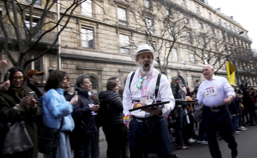 Participants carried trays each with a cup of coffee, a croissant and a glass of water.