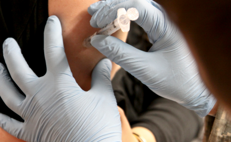 A person receives a flu shot in this undated photo.