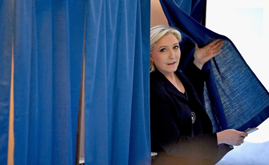 National Front Leader Marine Le Pen, casts her vote for the French elections in a polling station on April 23, 2017 in Henin Beaumont, France.