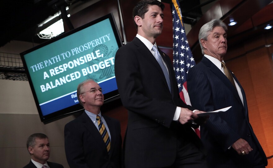 Rep. Paul Ryan (R-WI) (second from right), arrives with other GOP members of the House Budget Committee he chairs, for a news conference, March 12, 2013.