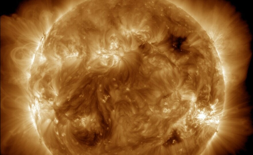 NASA's Solar Dynamics Observatory captured this image of solar flares early Saturday afternoon. The National Oceanic and Atmospheric Administration says there have been measurable effects and impacts from the geomagnetic storm.