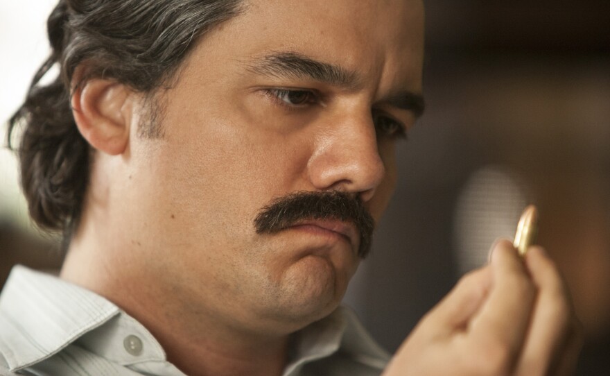 When he was cast in his Narcos role, Moura says, "I didn't look like Pablo Escobar at all."