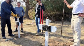 Volunteers put up cross markers at a historic cemetery in Del Mar for two girls from the La Colonia neighborhood who died in infancy. Nov 8, 2025