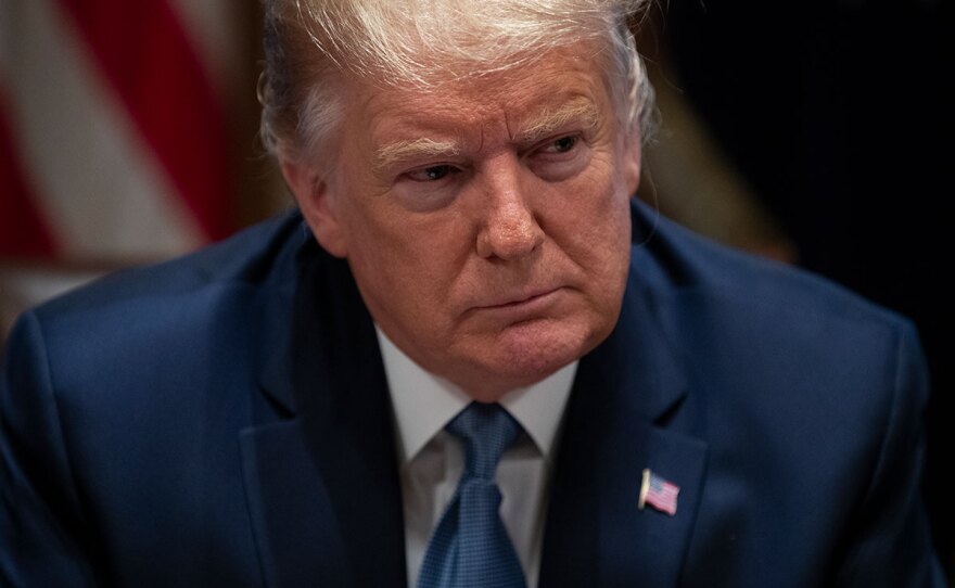 President Donald Trump listens during a roundtable with governors on government regulations in the Cabinet Room of the White House, Monday, Dec. 16, 2019, in Washington.