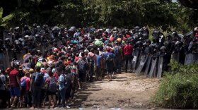 A new group of Central American migrants are met by Mexican Federal Police after the migrants waded in mass across the Suchiate River, that connects Guatemala and Mexico, in Tecun Uman, Guatemala, Monday, Oct. 29, 2018.