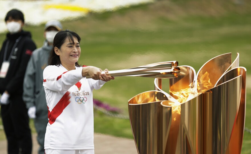 The last Olympic torch relay runner for the Osaka leg concludes the event in Suita, north of Osaka, western Japan, last month.