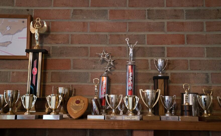Trophies collected from tiddlywinks competitions over the years.