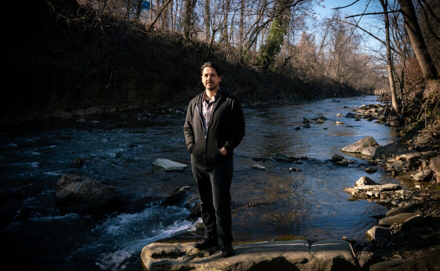 Michel Anderson does community outreach work for the clean water advocacy group Blue Water Baltimore. He says climate-driven extreme rain is exacerbating overflows and backups from the city's century-old sewer and stormwater pipes.