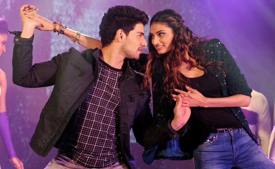Bollywood actors Sooraj Pancholi (left) and Athiya Shetty perform during a promotional event in Mumbai for the film Hero.