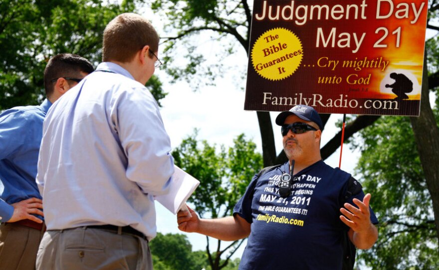 <p>On the National Mall in Washington, D.C., in May, David Liquori (right) talks with passersby. </p>