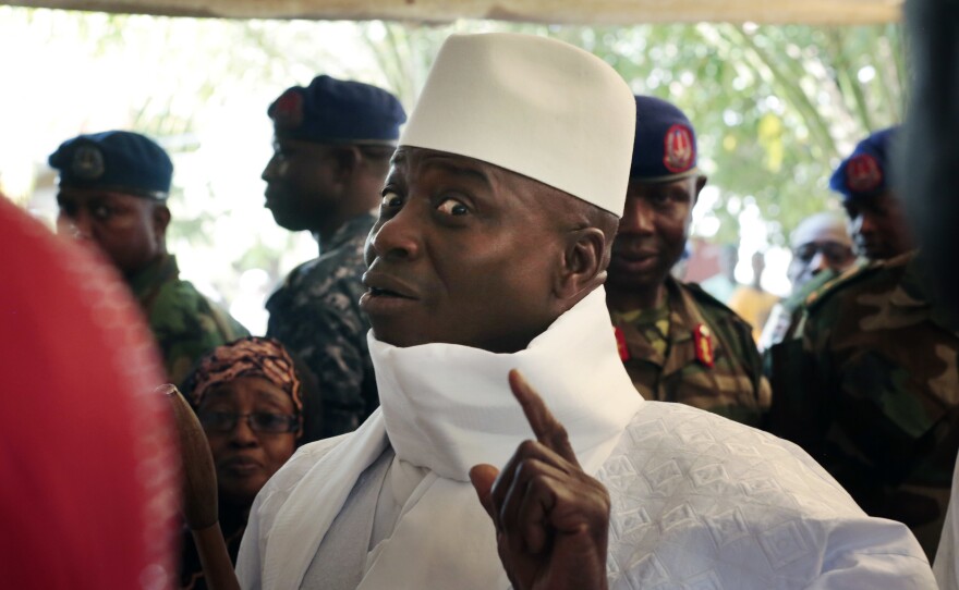 Gambia's president Yahya Jammeh shows his inked finger during voting earlier this month in Banjul, Gambia.