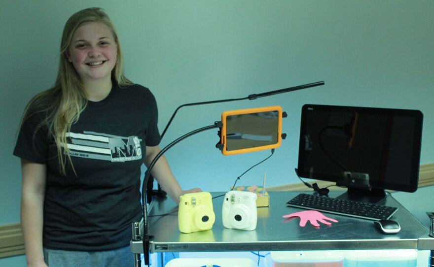 Emily Neblett poses with the first version of the mobile maker space at the Monroe Carell Jr. Children's Hospital at Vanderbilt University in Nashville, Tenn.