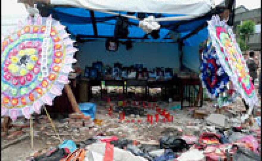 At the Fuxing primary school in Wufu, parents erected an altar to remember their children. At least 127 children died when the school collapsed on them.