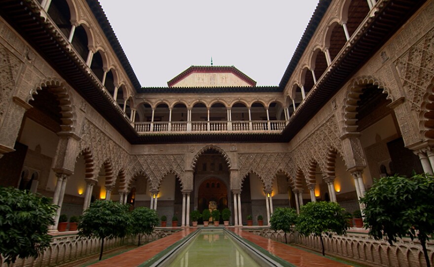 The Courtyard of the Maidens. In the mid-14th century, Muhammad V sought asylum at the Alcazar in Seville, the home of Pedro I. The two men shared an appreciate for each other's architectural taste and accomplishments. After Muhammad returned to the Alhambra, he built the Court of the Lions which is highly influenced by Pedro's courtyard.