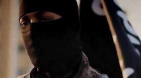 A photo provided by the FBI depicts a masked militant from an ISIS propaganda video from 2014. The individual pictured has allegedly been identified as Mohammed Khalifa.