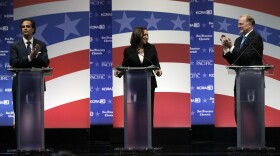 Tom Del Beccaro, left, and Duf Sundheim, right, applaud as Democratic state Attorney General Kamala Harris is introduced during a U.S. Senate debate at The University of the Pacific in Stockton, April 25, 2016. 