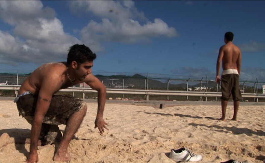 Jason DaSilva on the beach with his family.