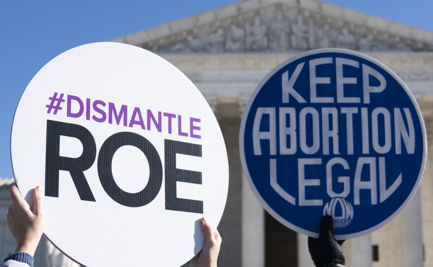 Anti-abortion rights activists counter-demonstrate as abortion rights activists participate in a "flash mob" demonstration outside the Supreme Court on Jan. 22 in Washington, D.C.