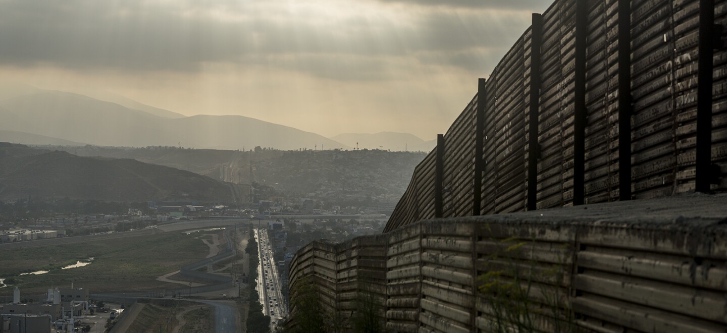 The majority of the primary fencing along the U.S.-Mexico border in San Diego is made of corrugated steel that once served as helicopter landing pads during the Vietnam War. This section, shown on Aug. 16, 2017, lines a hill leading west toward the San Ysidro Port of Entry.