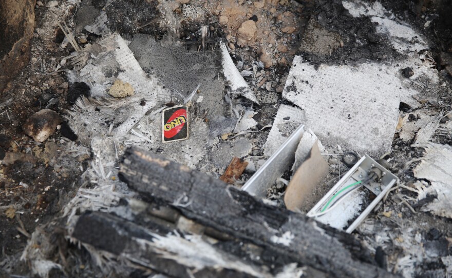 An Uno playing card lies in the rubble of the Ain al-Assad air base. The base, used by the U.S. since 2003, houses about 1,500 U.S. troops and additional coalition troops supporting Iraqi anti-ISIS operations.