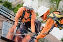 Solar workers install panels on an Oceanside home in this undated photo