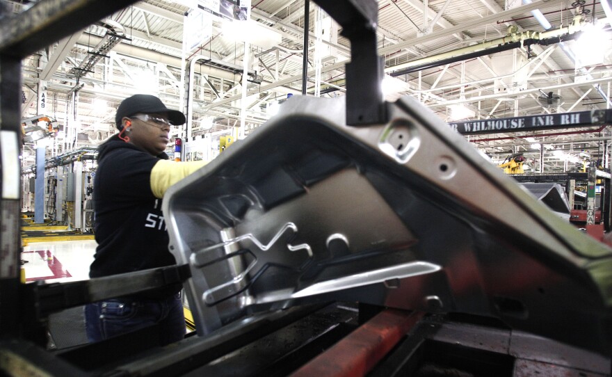 A worker is shown last month at the Fiat Chrysler Automobiles' Warren Stamping Plant in Warren, Mich.