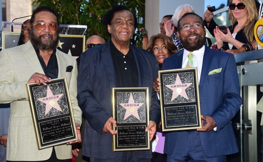 (From left) songwriters Eddie Holland, Lamont Dozier, and Brian Holland pose at their Hollywood Walk of Fame Star ceremony in 2015.