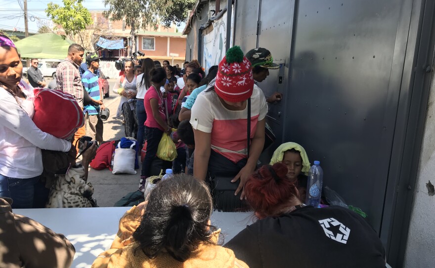 A group of people seeking asylum in the U.S. stand in line at a migrant shelter in Tijuana, April 25, 2018.