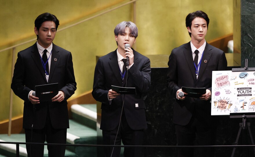 V (from left), Suga and Jin of BTS at the launch of the U.N. General Assembly's 76th session. The popular boy band from South Korea sang (in a video performance viewed online by more than 1 million) and spoke.
