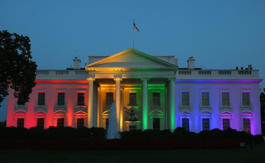 Rainbow-colored lights shine on the White House to celebrate today's US Supreme Court ruling in favor of same-sex marriage June 26, 2015 in Washington, DC.