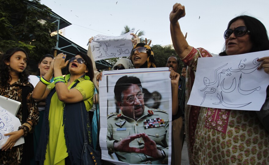 Musharraf supporters chant slogans on his behalf in Karachi on April 2, 2014.