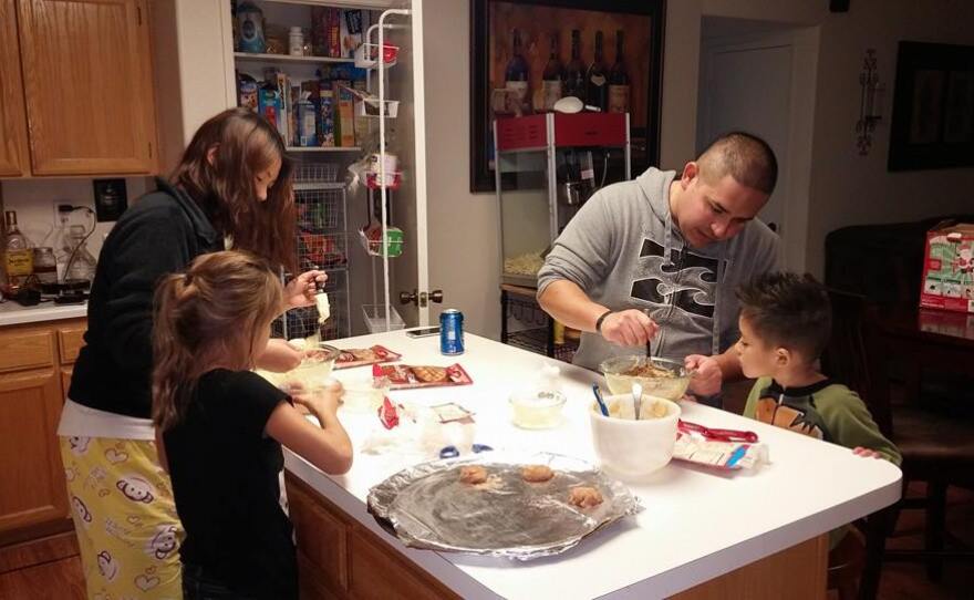 Charlie Grijalva, making cookies at Christmas with his children in 2014.