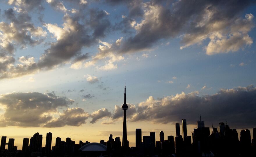 The Toronto skyline, seen in silhouette in 2015. The same skyline was used in an image posted by an account reportedly linked with the Saudi Arabian government, which featured an airliner headed toward the needle-shaped CN Tower.