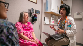 Nurse practitioner Surani Hayre-Kwan, right, speaks with patient Mary Valesano, left, and her caregiver Georgia Manolakos-Fraley, during a check-up at the Russian River Health Center in 2020.