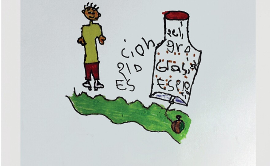 A drawing made by Anyelis, 7, of a man standing next to a land mine. "This is what we are taught at school," she says.