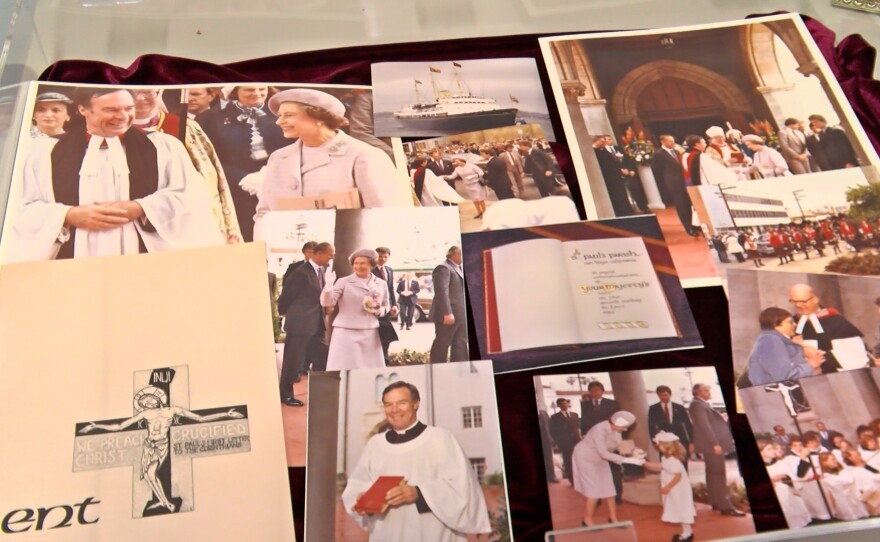 An exhibit of photos and memorabilia from the Queen's visit to St. Paul's is shown in the St. Paul's archive.