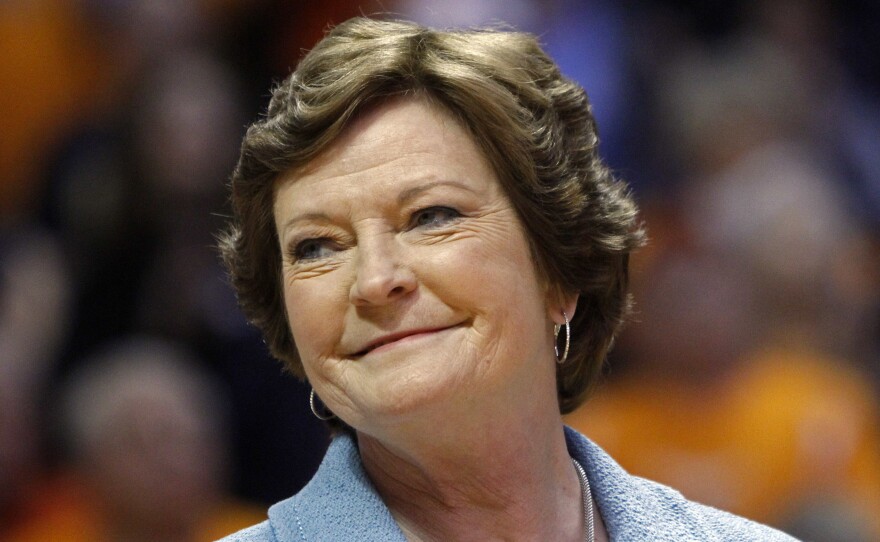 Former Tennessee women's basketball coach Pat Summitt smiles as a banner is raised in her honor before the team's game against Notre Dame in Knoxville in January 2013.