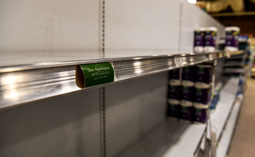 Toilet paper and paper towels shelves are mainly empty at a supermarket in Miami Beach, Fl., on Jan. 13. Staffing shortages tied to the omicron variant and continued supply chain disruptions have led to shortages of some goods at many supermarkets.