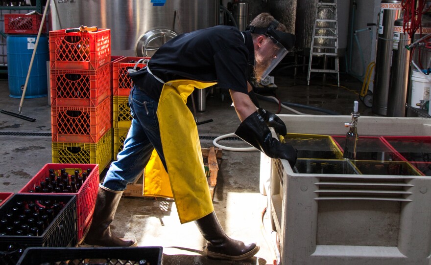 Nat West checks the pasteurization temperatures at his cidery in Portland, Ore.