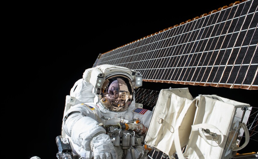 NASA astronaut Scott Kelly works outside the International Space Station during a spacewalk last year.