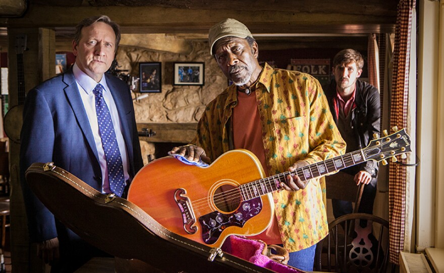 A scene from "The Ballad of Midsomer County" featuring DCI John Barnaby (Neil Dudgeon), Frank Wainwright (Clarke Peters) and DS Charlie Nelson (Gwilym Lee). Could a ballad made famous by late, lamented folk singer Johnny Carver be an inspiration for murder.