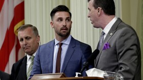 Assemblyman Ian Calderon, D-Whittier, center, talks with Assemblyman Kevin Mullen, D-South San Francisco, right, at the Capitol, in Sacramento, Calif., Monday, June 18, 2018. 
