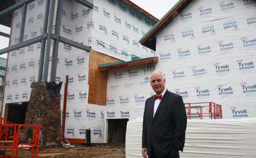 Atlantic City Mayor Don Guardian stands in front of an outdoor goods store under construction. The state's Casino Reinvestment Development Authority contributed land and $12 million for the project.